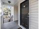 Private condo entry with black door and keypad at 3270 Haviland Ct # 304, Palm Harbor, FL 34684