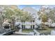 Two-story building with multiple units, parking and landscaping at 3270 Haviland Ct # 304, Palm Harbor, FL 34684