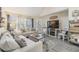Spacious living room with comfy sofas, a fireplace, and large windows at 3270 Haviland Ct # 304, Palm Harbor, FL 34684