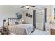 Bedroom with moon and stars wall decor, full-size bed, and dresser at 36033 Sunflower Hill Dr, Zephyrhills, FL 33541