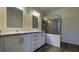Primary bathroom with dual vanities and a large glass enclosed shower with tile surround at 3729 Winward Lakes Dr, Tampa, FL 33611
