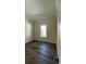 Bright bedroom featuring neutral walls, new flooring, and ample natural light at 3729 Winward Lakes Dr, Tampa, FL 33611