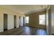 Spacious bedroom with wood-look flooring, two windows and dual closets with sliding doors at 3729 Winward Lakes Dr, Tampa, FL 33611