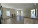Spacious living room features new flooring, light-filled windows, and neutral walls at 3729 Winward Lakes Dr, Tampa, FL 33611