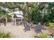 Landscaped backyard with fire pit and seating area at 3817 W Dale Ave # 2, Tampa, FL 33609