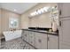 Elegant bathroom with double vanity and patterned tile floors at 3817 W Dale Ave # 2, Tampa, FL 33609