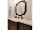Elegant bathroom with a modern vanity and decorative mirror at 3817 W Dale Ave # 2, Tampa, FL 33609