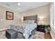 Comfortable bedroom with hardwood floors and a plush bed at 3817 W Dale Ave # 2, Tampa, FL 33609