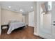 Simple bedroom with hardwood floors and private door at 3817 W Dale Ave # 2, Tampa, FL 33609