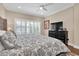 Spacious bedroom with hardwood floors and large window at 3817 W Dale Ave # 2, Tampa, FL 33609