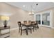 Bright dining area featuring a wood table and sliding glass doors at 3817 W Dale Ave # 2, Tampa, FL 33609
