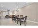 Elegant dining room with a large table and chandelier at 3817 W Dale Ave # 2, Tampa, FL 33609