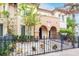 Attractive 2-story home with arched entry and gated front yard at 3817 W Dale Ave # 2, Tampa, FL 33609