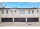 Three-car garage with individual doors for each unit at 3817 W Dale Ave # 2, Tampa, FL 33609