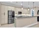 Updated kitchen with stainless steel appliances and granite island at 3817 W Dale Ave # 2, Tampa, FL 33609