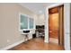 Home office with hardwood floors and private elevator access at 3817 W Dale Ave # 2, Tampa, FL 33609