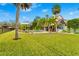 Spacious backyard oasis featuring a pool and cabana at 5906 N Kenneth Ave, Tampa, FL 33604