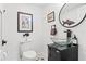 Small bathroom with glass vessel sink and decorative accents at 5906 N Kenneth Ave, Tampa, FL 33604