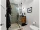 Modern bathroom with glass shower and wood vanity at 5906 N Kenneth Ave, Tampa, FL 33604