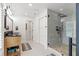 Modern bathroom with double vanity and walk-in shower at 5906 N Kenneth Ave, Tampa, FL 33604
