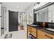 Bathroom with double vanity and barn door at 5906 N Kenneth Ave, Tampa, FL 33604