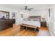 Bright bedroom with hardwood floors and wooden furniture at 5906 N Kenneth Ave, Tampa, FL 33604