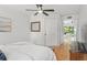 Bright bedroom with tiled floors and access to a patio at 5906 N Kenneth Ave, Tampa, FL 33604