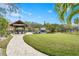 Private boat dock with covered area on calm water at 5906 N Kenneth Ave, Tampa, FL 33604