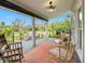 Spacious covered deck with wicker furniture and rug at 5906 N Kenneth Ave, Tampa, FL 33604