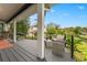 Relaxing deck overlooking the backyard with seating area at 5906 N Kenneth Ave, Tampa, FL 33604