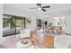 Bright dining area with terracotta tile floors and access to patio at 5906 N Kenneth Ave, Tampa, FL 33604