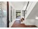Bright entryway with brick flooring, glass door, and staircase at 5906 N Kenneth Ave, Tampa, FL 33604