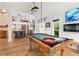 Game room features a stylish pool table and high ceilings at 5906 N Kenneth Ave, Tampa, FL 33604