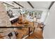 Open floor plan with hardwood floors, exposed beams, and high ceilings at 5906 N Kenneth Ave, Tampa, FL 33604