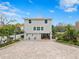 Two-story house back with paver driveway at 5906 N Kenneth Ave, Tampa, FL 33604