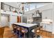 Modern kitchen with a large island and unique barn door at 5906 N Kenneth Ave, Tampa, FL 33604