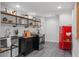 Charming kitchen with red refrigerator, wood shelves and modern stove at 5906 N Kenneth Ave, Tampa, FL 33604