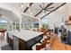 Open concept kitchen with island, high ceilings, and hardwood floors at 5906 N Kenneth Ave, Tampa, FL 33604