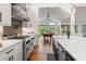 Kitchen features stainless steel appliances and white cabinetry at 5906 N Kenneth Ave, Tampa, FL 33604