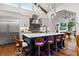 Modern kitchen with stainless steel appliances and hardwood floors at 5906 N Kenneth Ave, Tampa, FL 33604