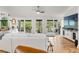 Spacious living room with large windows and hardwood floors at 5906 N Kenneth Ave, Tampa, FL 33604