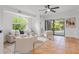 Living room with sliding doors to the backyard and a cozy seating area at 5906 N Kenneth Ave, Tampa, FL 33604