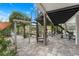 Outdoor patio with spiral staircase, offering tranquil garden views at 5906 N Kenneth Ave, Tampa, FL 33604