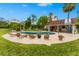 Relaxing pool area with lounge chairs and a stone patio at 5906 N Kenneth Ave, Tampa, FL 33604