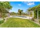 Landscaped backyard with pool and pergola at 5906 N Kenneth Ave, Tampa, FL 33604