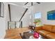 Relaxing sitting area with a comfortable couch and large window at 5906 N Kenneth Ave, Tampa, FL 33604