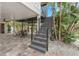Exterior stairs leading down to the patio area at 5906 N Kenneth Ave, Tampa, FL 33604