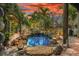 Relaxing backyard water feature with pond and waterfall at 5906 N Kenneth Ave, Tampa, FL 33604