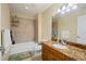 Bathroom with granite vanity and shower/tub combo at 628 Cleveland St # 1201, Clearwater, FL 33755