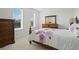 Bedroom with a double bed and wood furniture at 628 Cleveland St # 1201, Clearwater, FL 33755